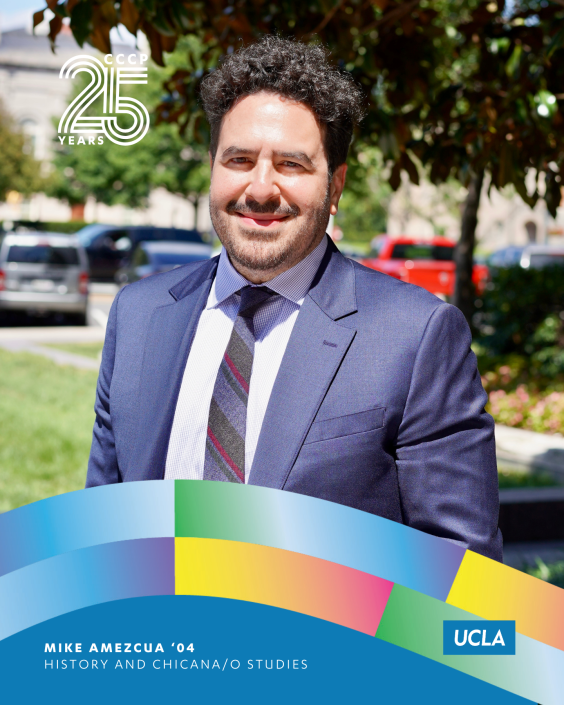 CCCP 25th anniversary profile graphic featuring Mike Amezcua smiling outdoors in a navy suit, light dress shirt, and striped tie. Trees, grass, parked cars, and campus buildings appear in the background. The CCCP 25 Years logo is at the top left, colorful curved ribbon graphics frame the bottom, and the UCLA logo appears at the lower right. Text reads: “Mike Amezcua ’04, History and Chicana/o Studies.”